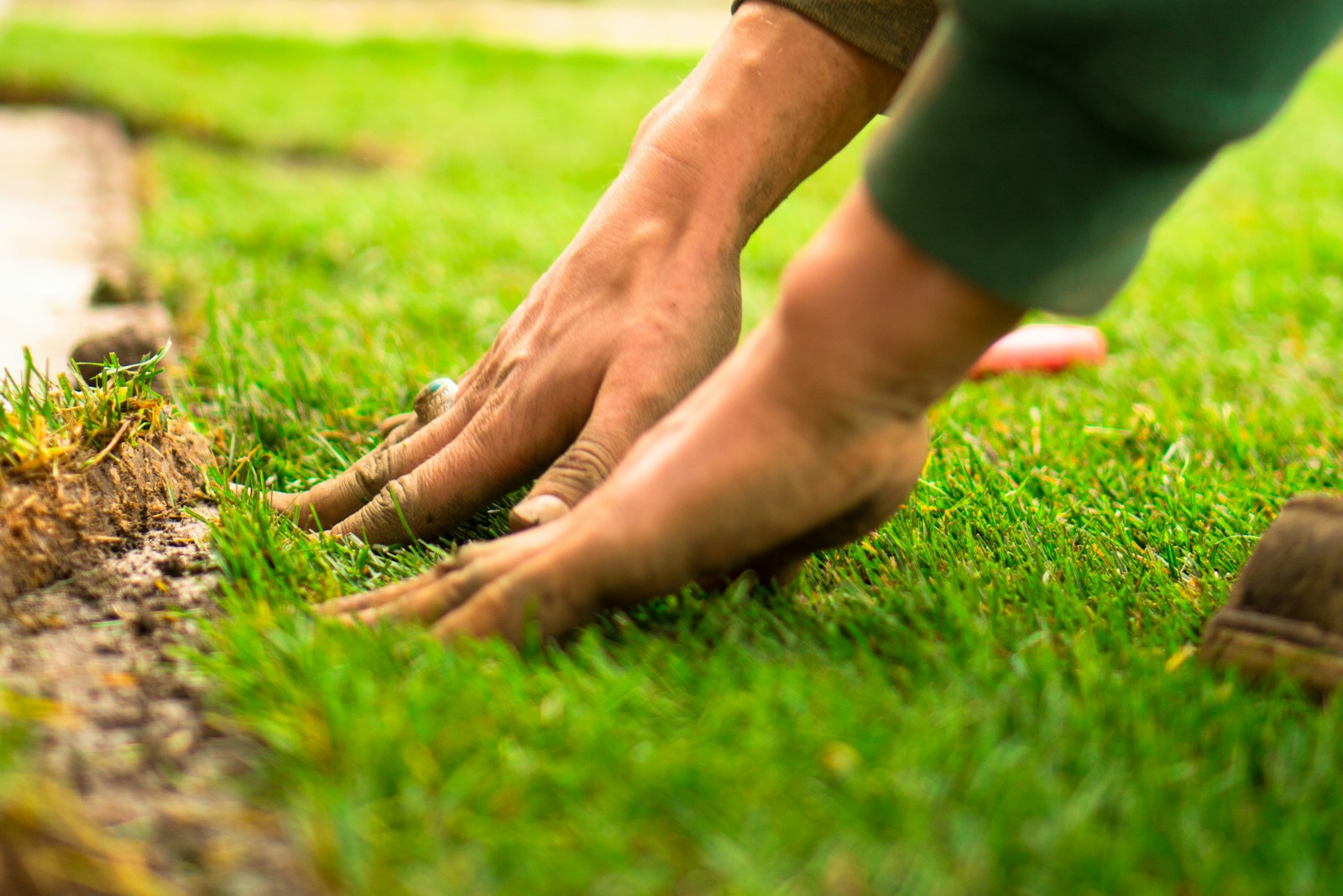 A close up of a person's feet on the grass